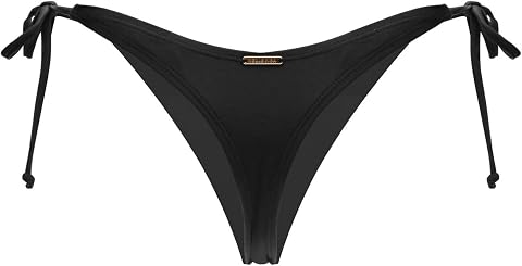 Bas de bikini string noir à liens latéraux noués, posé sur une pierre claire