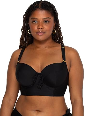 Haut de bikini noir à armatures, posé sur pierre claire avec ses bonnets trois pièces et ses bretelles réglables.